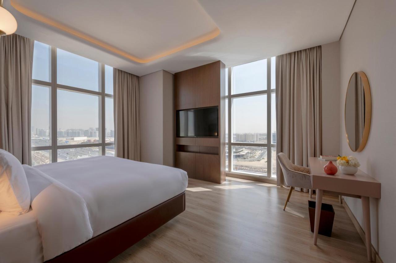 דובאי Movenpick Jumeirah Village Triangle מראה חיצוני תמונה A bedroom at the hotel