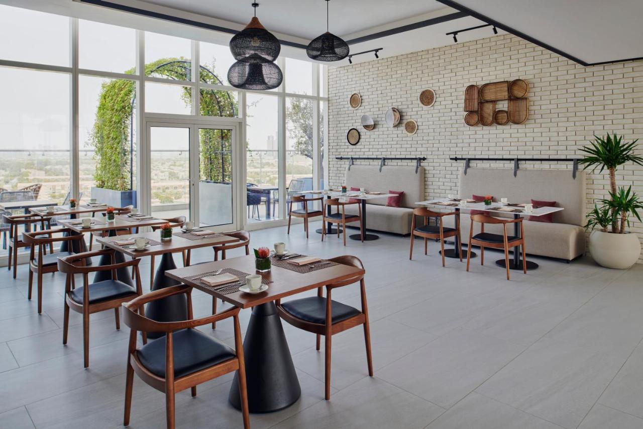 דובאי Movenpick Jumeirah Village Triangle מראה חיצוני תמונה Restaurant